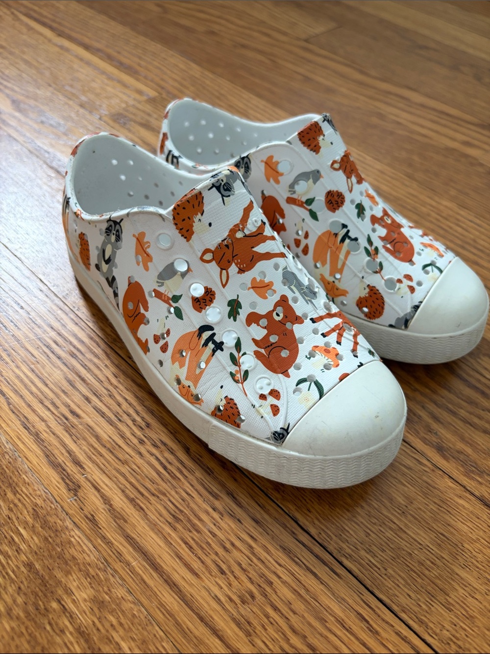 Native Kids White Slip-On Sneakers with Orange Animal Print